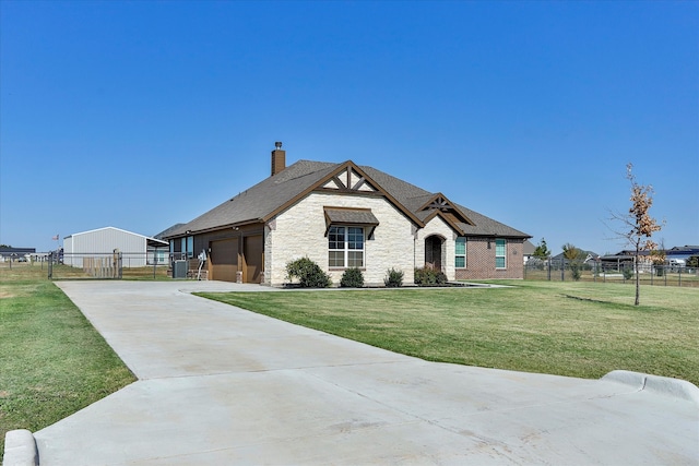 view of front of home featuring a front yard and a garage