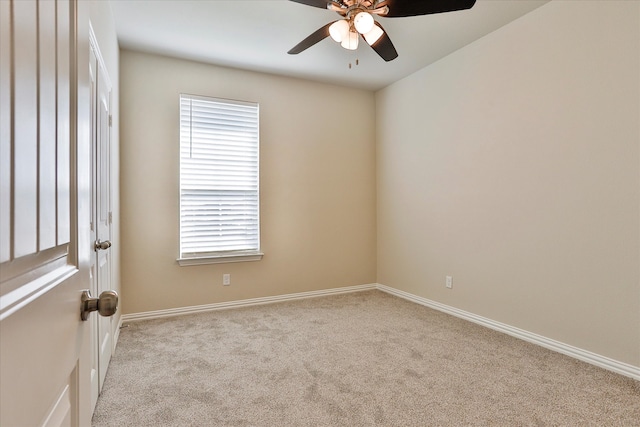 carpeted empty room featuring ceiling fan