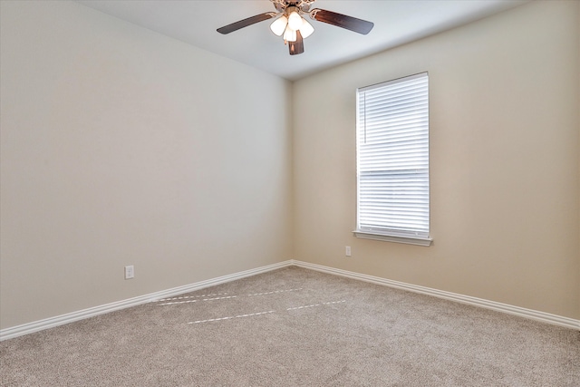 carpeted empty room with ceiling fan