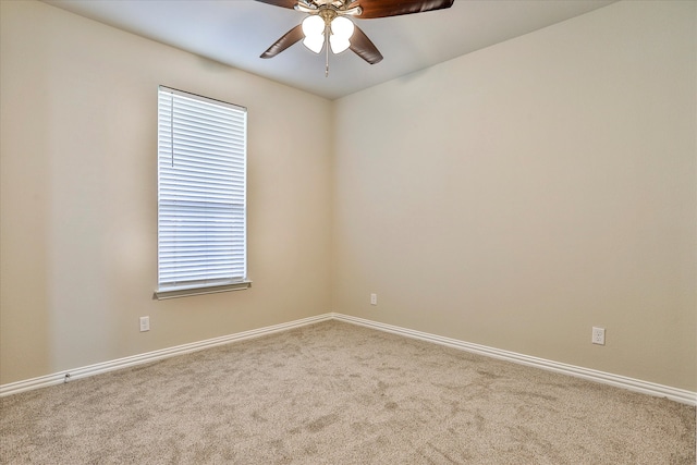 empty room featuring ceiling fan and carpet flooring