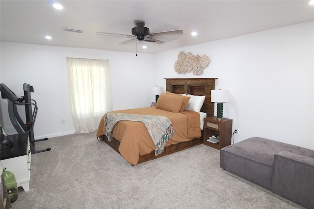 bedroom featuring light carpet and ceiling fan