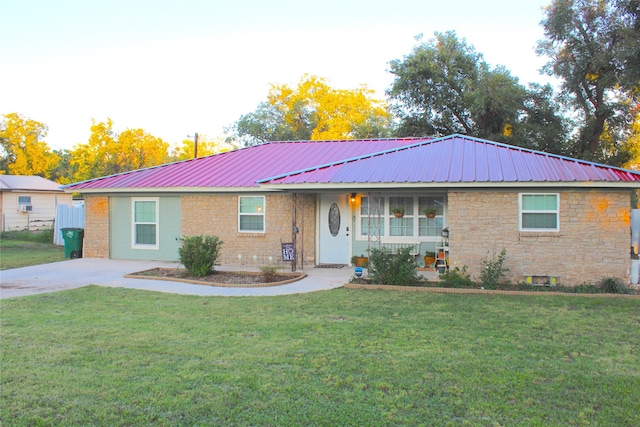 single story home with a front yard