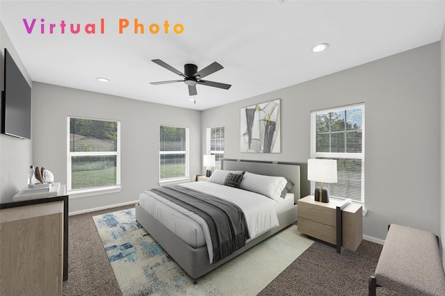 carpeted bedroom featuring multiple windows and ceiling fan