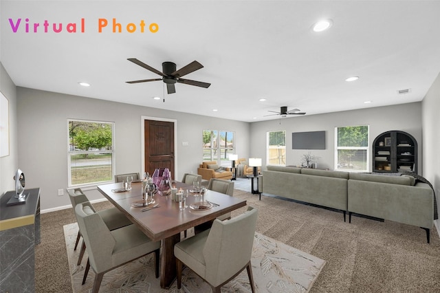 dining space featuring carpet flooring and ceiling fan