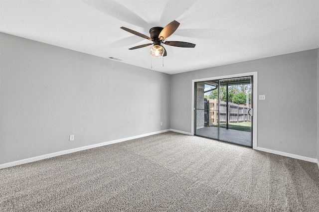 spare room with carpet floors and ceiling fan