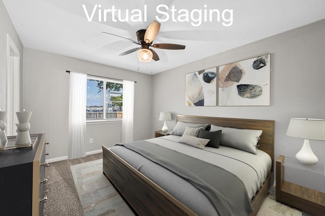 bedroom featuring ceiling fan and light colored carpet