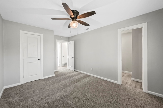 unfurnished bedroom with carpet flooring and ceiling fan