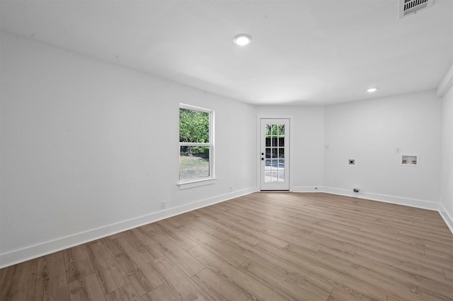 unfurnished room featuring light wood-type flooring