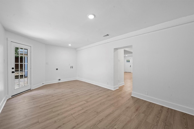 spare room with light hardwood / wood-style flooring