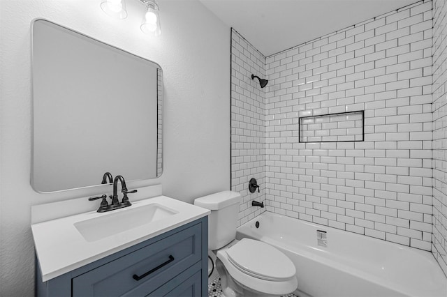 full bathroom with vanity, tiled shower / bath combo, and toilet