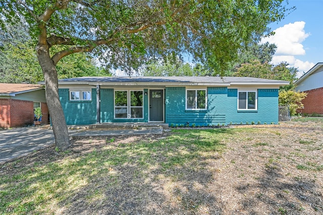 single story home featuring a carport