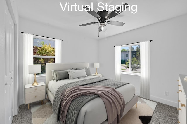 bedroom featuring ceiling fan and light colored carpet