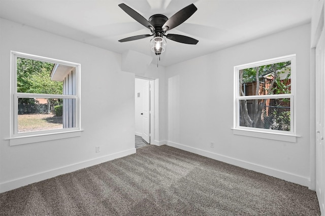 carpeted empty room with ceiling fan