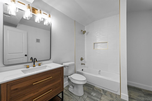 full bathroom featuring vanity, toilet, and tiled shower / bath