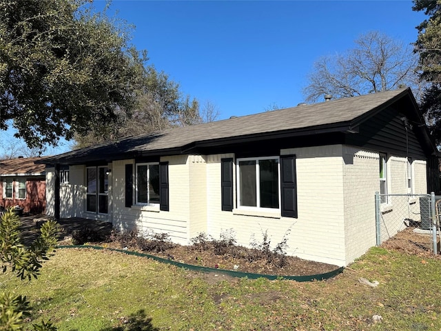 view of property exterior featuring a lawn