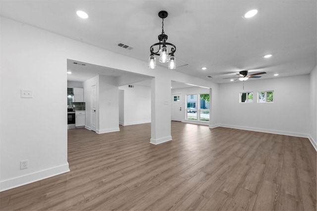 interior space with ceiling fan and light hardwood / wood-style flooring