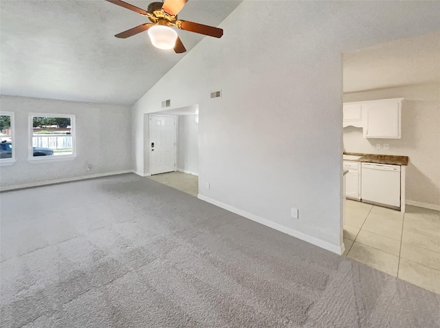 unfurnished living room with visible vents, light carpet, baseboards, and ceiling fan
