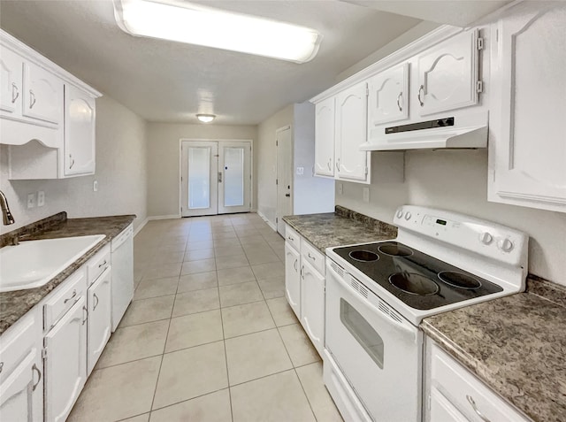 kitchen featuring white appliances, white cabinetry, and sink