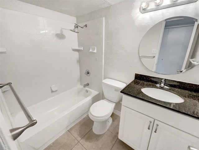 full bathroom featuring tile patterned flooring, tiled shower / bath, vanity, and toilet