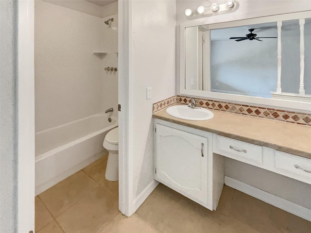 full bathroom featuring toilet, tile patterned floors, vanity,  shower combination, and backsplash