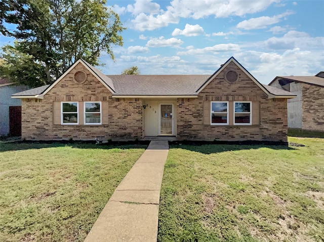 ranch-style house with a front lawn