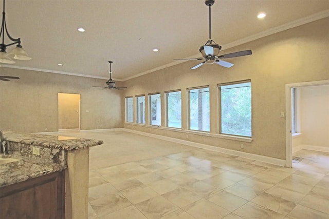 empty room featuring ceiling fan and ornamental molding