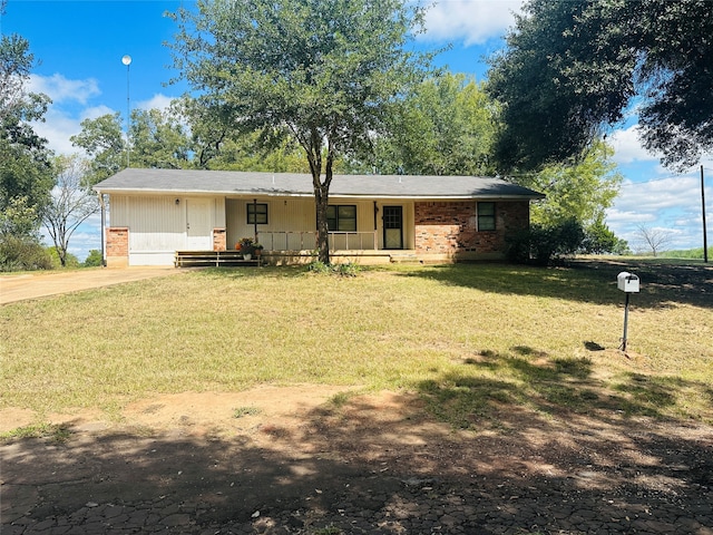 view of front of property with a porch and a front lawn