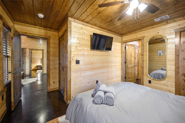 bedroom with wood ceiling, wood walls, ceiling fan, and dark hardwood / wood-style flooring