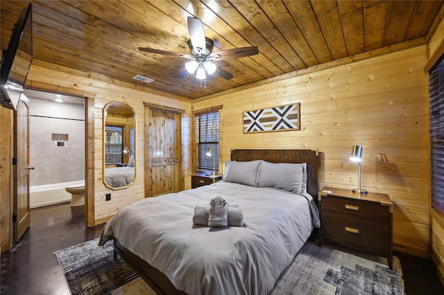 bedroom featuring ceiling fan, wooden walls, connected bathroom, and wood ceiling