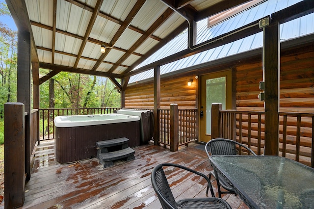 wooden terrace with a hot tub