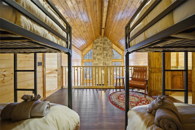 bedroom with wood ceiling, wooden walls, vaulted ceiling with beams, and dark hardwood / wood-style floors