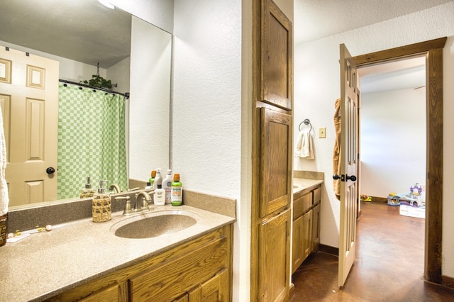 bathroom featuring concrete flooring and vanity