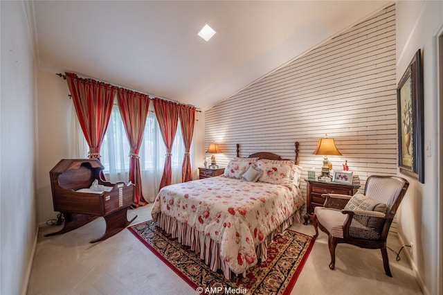 bedroom featuring high vaulted ceiling and carpet floors