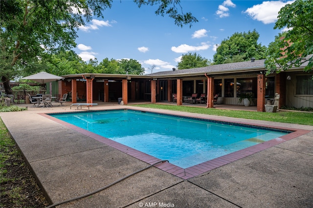 view of swimming pool featuring a patio