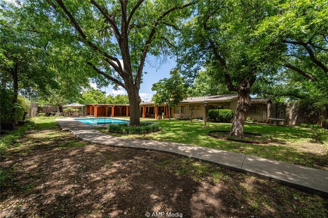 923 W Lake Dr, Hamlin, TX 79520 - view of yard with an outdoor pool and fence