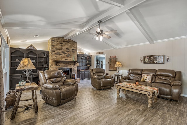 living room with a fireplace, crown molding, ceiling fan, vaulted ceiling with beams, and hardwood / wood-style floors