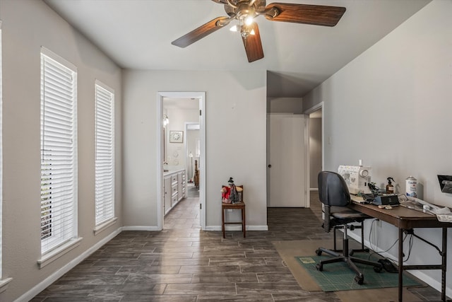 office area with ceiling fan and dark hardwood / wood-style floors