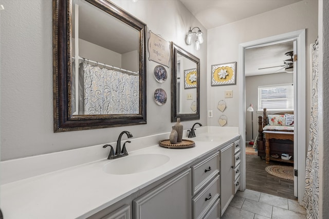 bathroom with ceiling fan, vanity, and hardwood / wood-style flooring