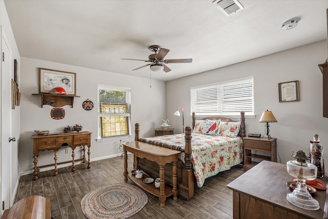 bedroom with multiple windows, ceiling fan, and dark hardwood / wood-style flooring