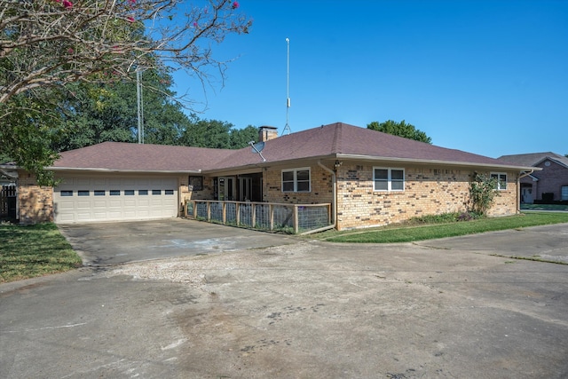 ranch-style house featuring a garage