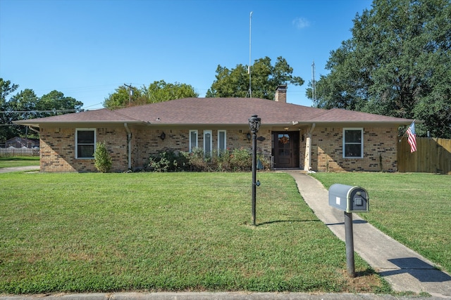 single story home featuring a front yard