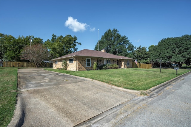 ranch-style home with a front yard