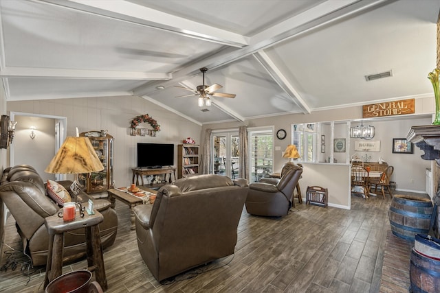 living room featuring ceiling fan with notable chandelier, lofted ceiling with beams, and dark hardwood / wood-style flooring