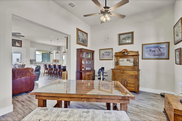 dining room featuring light wood-type flooring and ceiling fan