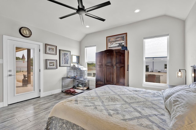 bedroom featuring light hardwood / wood-style floors, multiple windows, and ceiling fan