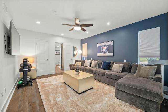 living room with ceiling fan and hardwood / wood-style floors