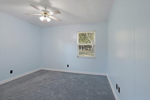 carpeted empty room featuring ceiling fan and crown molding