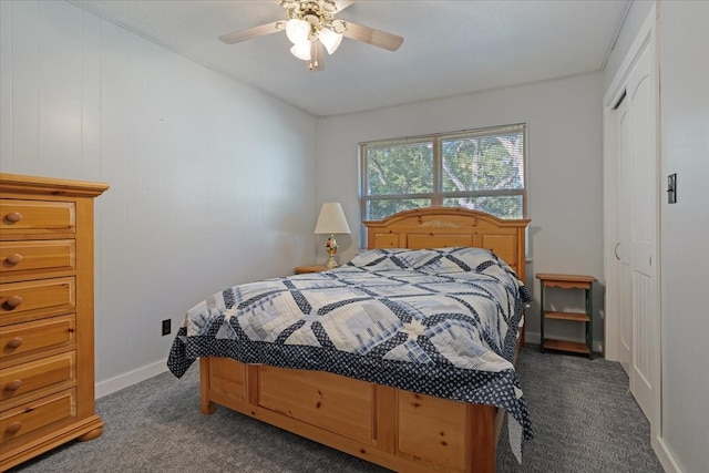 bedroom with dark carpet and ceiling fan