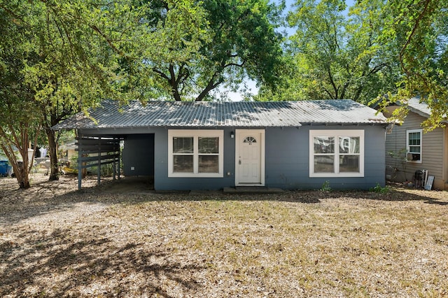 single story home featuring a carport