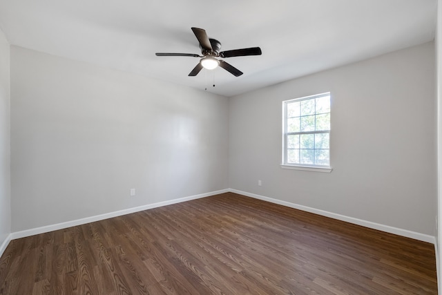 unfurnished room featuring dark hardwood / wood-style floors and ceiling fan